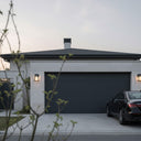 Outway solar wall light lighting a driveway