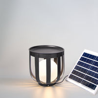 Black outdoor solar floor lamp with solar panel on a gray background