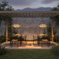 A dining area featuring a pergola, chairs, and a Solar Handwoven Ceiling Light illuminating the space.