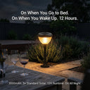 Solar lamp on a patio with wine glasses and text about runtime