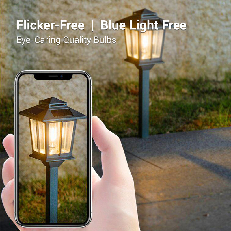 Hand holding a smartphone showing an image of a street lamp with 'Flicker-Free | Blue Light Free' text.
