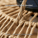 The PT0901 Kiku Solar Rattan Hanging Lantern hanging in a bright, modern indoor dining room, showcasing its versatility as a stylish decor piece for both inside and outside.