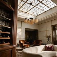 Natural bamboo light fixture above lounge area in desert adobe patio with mountain view