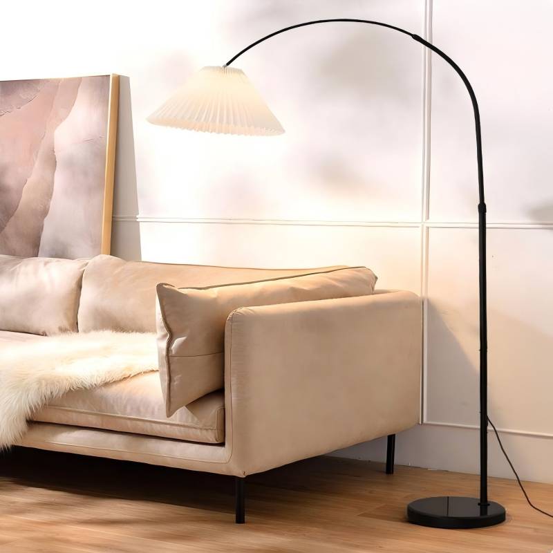 Modern living room with a beige sofa and a black floor lamp.