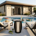 Modern outdoor patio with pool, lounge chairs, and a table with a drink.