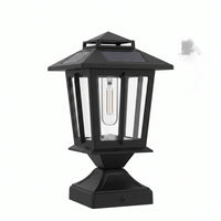 Front-facing studio shot of HeritagePost Solar Lantern on white background, displaying its matte black die-cast aluminum frame, clear glass panels, and integrated polycrystalline solar panel — perfect for product detail pages highlighting craftsmanship and design.