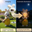 Split image of OUTWAY Hoppi A004 standing solar bubble rabbit showing solar panel on back charging in Australian sunlight on the left and automatic warm LED glow at night on the right with callouts Solar powered no wiring no batteries just place it 6 to 8 hours fully charged 8 to 10 hours warm light automatically turns on at dusk