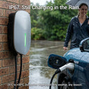 Outway EV05 outdoor wallbox charging an EV in the rain, highlighting its IP67 waterproof rating and durability in extreme weather.