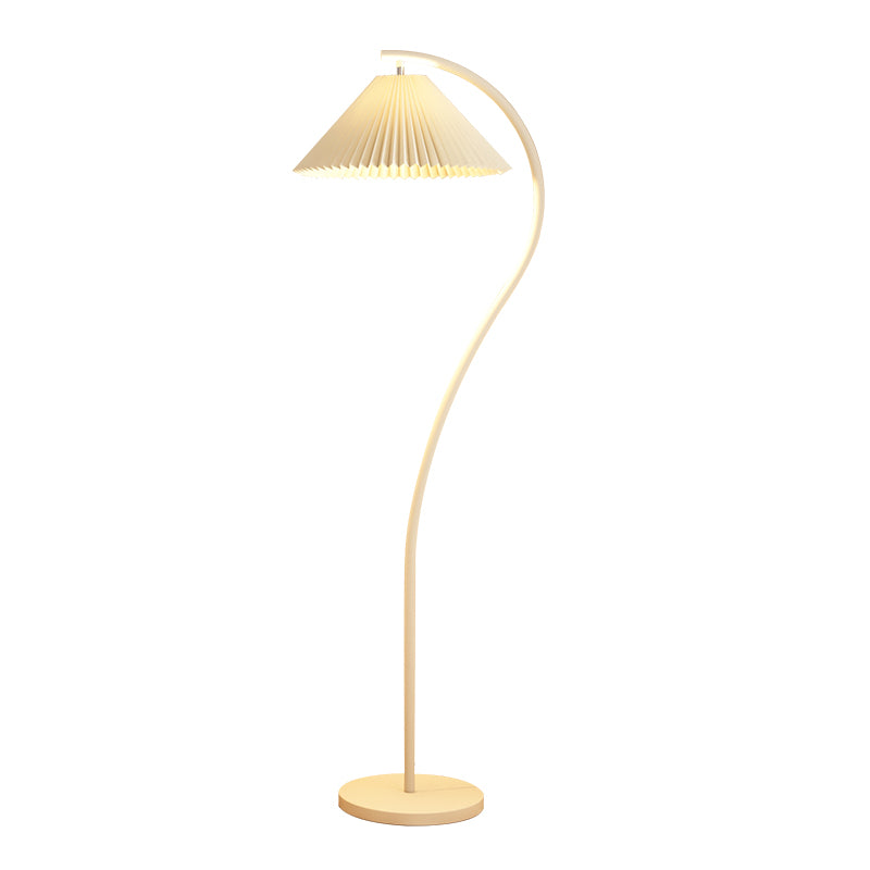 A modern floor lamp with a curved wooden stand, a round base, and a pleated shade on a solid white background.