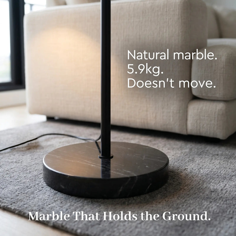 Marble floor lamp with text on a living room background