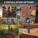 Installation options infographic for the PT0723 showing two methods side by side: ground spike insertion into soft garden soil on the left, and screw-mount bracket fixed to a timber deck on the right, each with close-up hands-on detail shots and the assembled bollard shown in situ.
