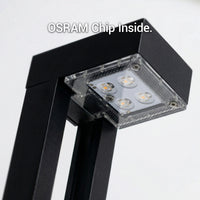 Black lamp with OSRAM chip inside on a white background
