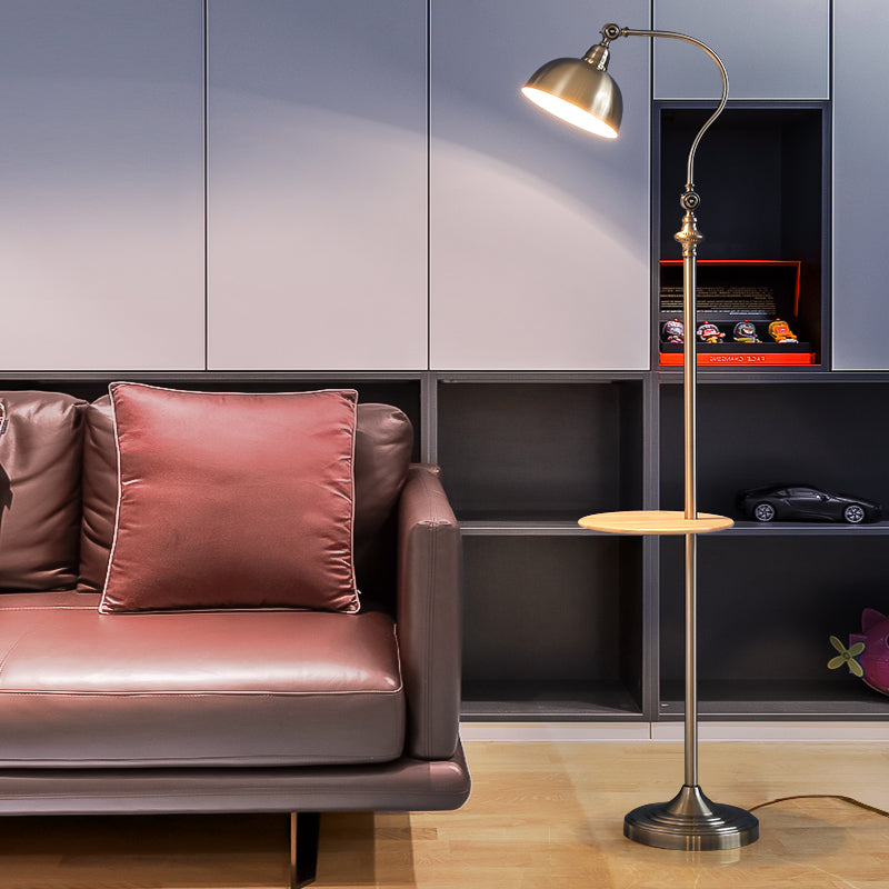 Modern living room with a brown leather sofa and a standing lamp.