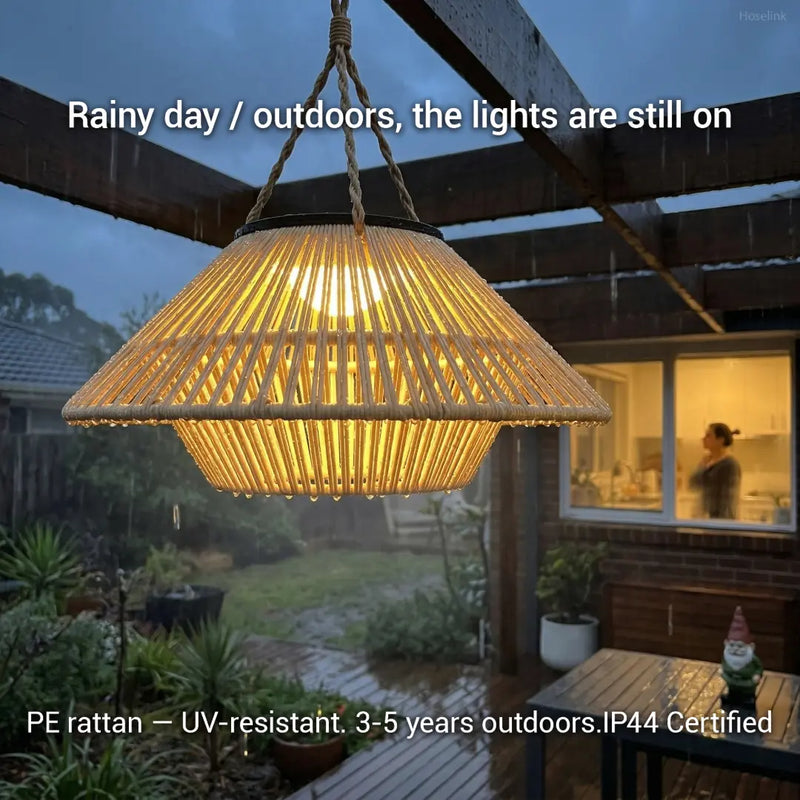 HAIKU weather-resistant solar light glowing in the rain under a wooden pergola, demonstrating its IP44 waterproof certification and durability outdoors.