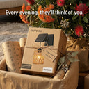 Gift-wrapped PT0909 Kasa Solar Wall Light box from OUTWAY, nestled among native flowers and twine — “Every evening, they’ll think of you” tagline emphasizes emotional value as housewarming or Mother’s Day gift.