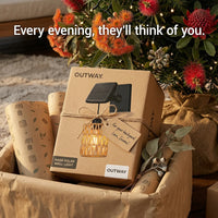 Gift-wrapped PT0909 Kasa Solar Wall Light box from OUTWAY, nestled among native flowers and twine — “Every evening, they’ll think of you” tagline emphasizes emotional value as housewarming or Mother’s Day gift.