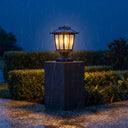 HeritagePost Solar Lantern glowing atop brick pillar during heavy rainfall at night, proving its IP44/IP65 weatherproof resilience in extreme conditions — reassuring customers of long-term reliability in Melbourne downpours or coastal humidity.
