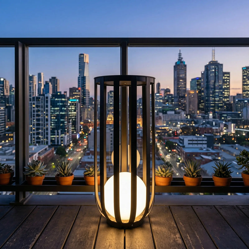 Solar outdoor lamp on stone patio with rose bushes, garden pathway lighting with natural stone surface, weather-resistant solar lantern for landscape decor, modern metal floor lamp with soft warm light, IP65 waterproof garden lighting