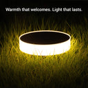 Glowing solar pathway light on grass at night with the text "Warmth that welcomes. Light that lasts.", emitting a soft 3000K warm white light for outdoor safety and decor.