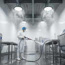 Outway high bay LED lights operating in a commercial kitchen during high-pressure steam cleaning, demonstrating IP65 waterproof performance in a food-safe environment.