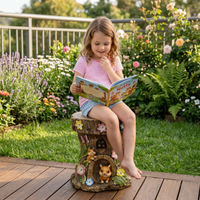 Young girl reading a book in Outway Tree Stump Stool 3-in-1 functions – garden stool