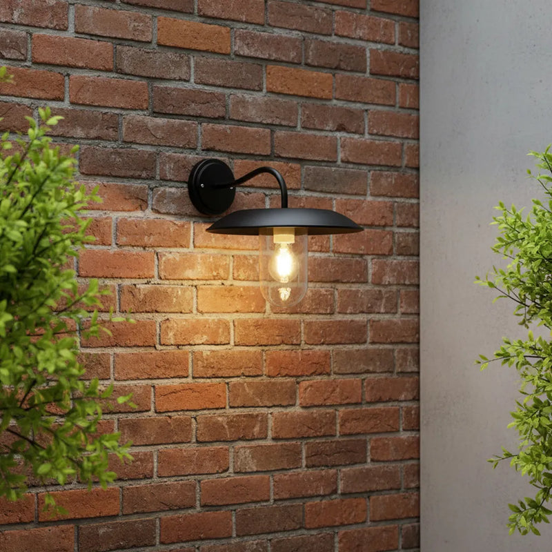 solar wall light mounted on a brick wall, providing soft illumination