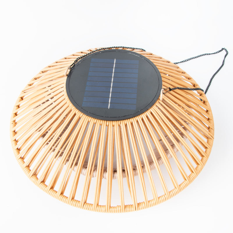 Wicker basket with a Solar Ceiling Light  on a white background