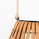 Close-up of a solar lawn light with a rope handle on a white background