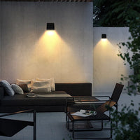 Outdoor setting with a wall-mounted solar light.