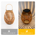 A solar-powered bamboo lantern with a light and a switch, designed for garden and lawn illumination.
