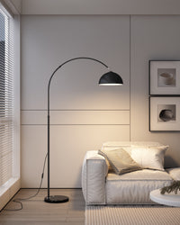 Modern arc floor lamp in a cozy living room setup.