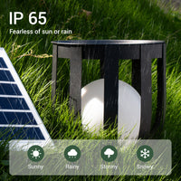 Solar floor lamp with IP 65 rating in grass, showing durability in various weather conditions.