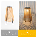 Two images of a Solar Handwoven Garden Lawn Light, showcasing the lamp illuminated in a garden setting.