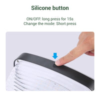 Silicone button on a solar pillar light with text instructions for operation.