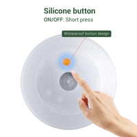 Round solar light featuring a silicone button on the side for easy operation.