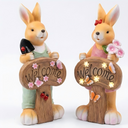 Close-up of hand-painted Welcome sign on PT0612 solar rabbit garden ornament