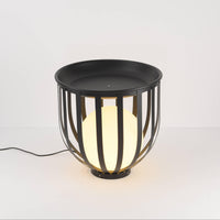 Close-up view of indoor floor lamp and matte metal top.