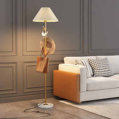 Floor lamp with soft fabric shade for warm ambient light.