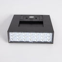 Minimalist modern solar wall lamp with a sleek black finish. Adds style and function to any space.