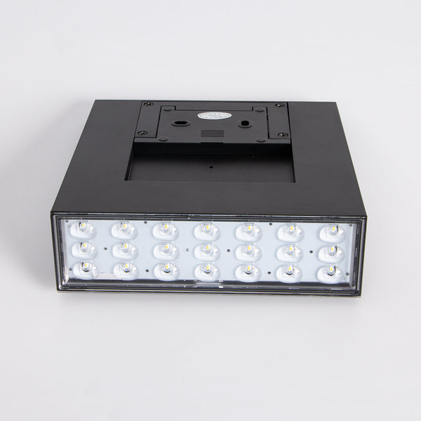 Minimalist modern solar wall lamp with a sleek black finish. Adds style and function to any space.
