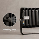 Black outdoor LED light bar with a circular inset showing a breathing valve, on a textured gray background.