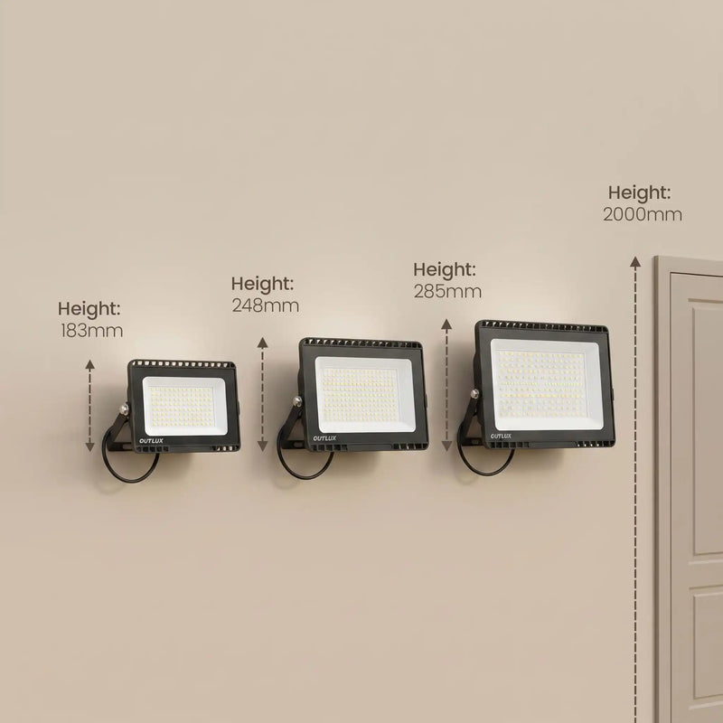 Three black wall-mounted LED floodlights shown on a beige wall with height measurement labels and arrows indicating 183mm, 248mm, 285mm, and 2000mm.