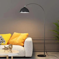 Floor lamp with remote control for dimming and color adjustment.