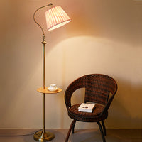 Sturdy gold lamp stand with non-slip pads.