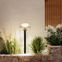 Vela solar lawn light with warm white glow for garden decoration
